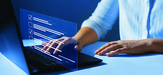 Man completing a Digital Scorecard on Laptop