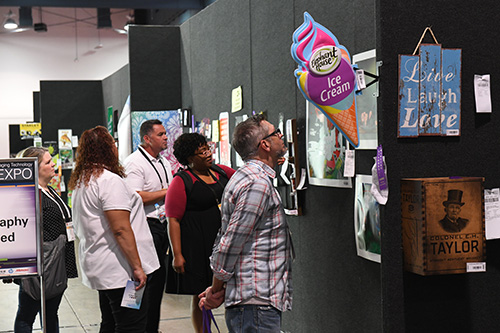 Attendees in Golden Image Gallery with Prints