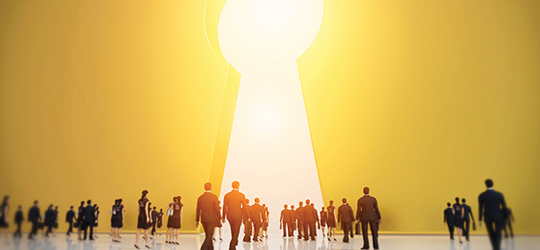 business people walking to keyhole