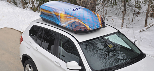 a thermoformed storage container for the top of a car