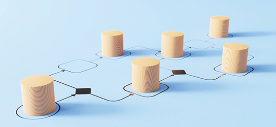 Wooden pegs in a flowchart, illustrating workflow