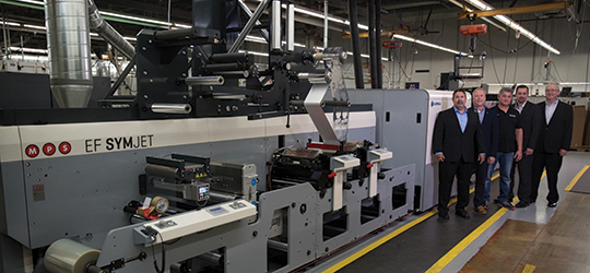 Team members at Minneapolis-based Meyers stand with the company's MPS EF SYMJET powered by Domino hybrid press