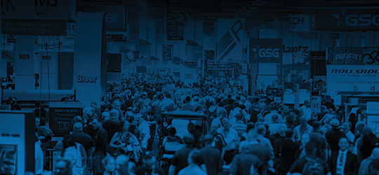 monochrome blue photo of the packed show floor at printing united expo 2024